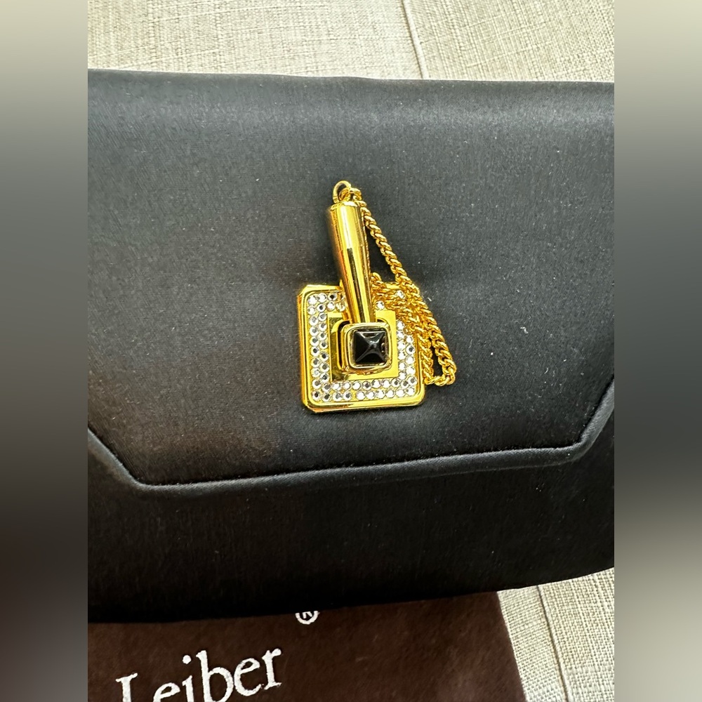 Judith Lieber evening clutch with dust bag and accessories including 42” strap.